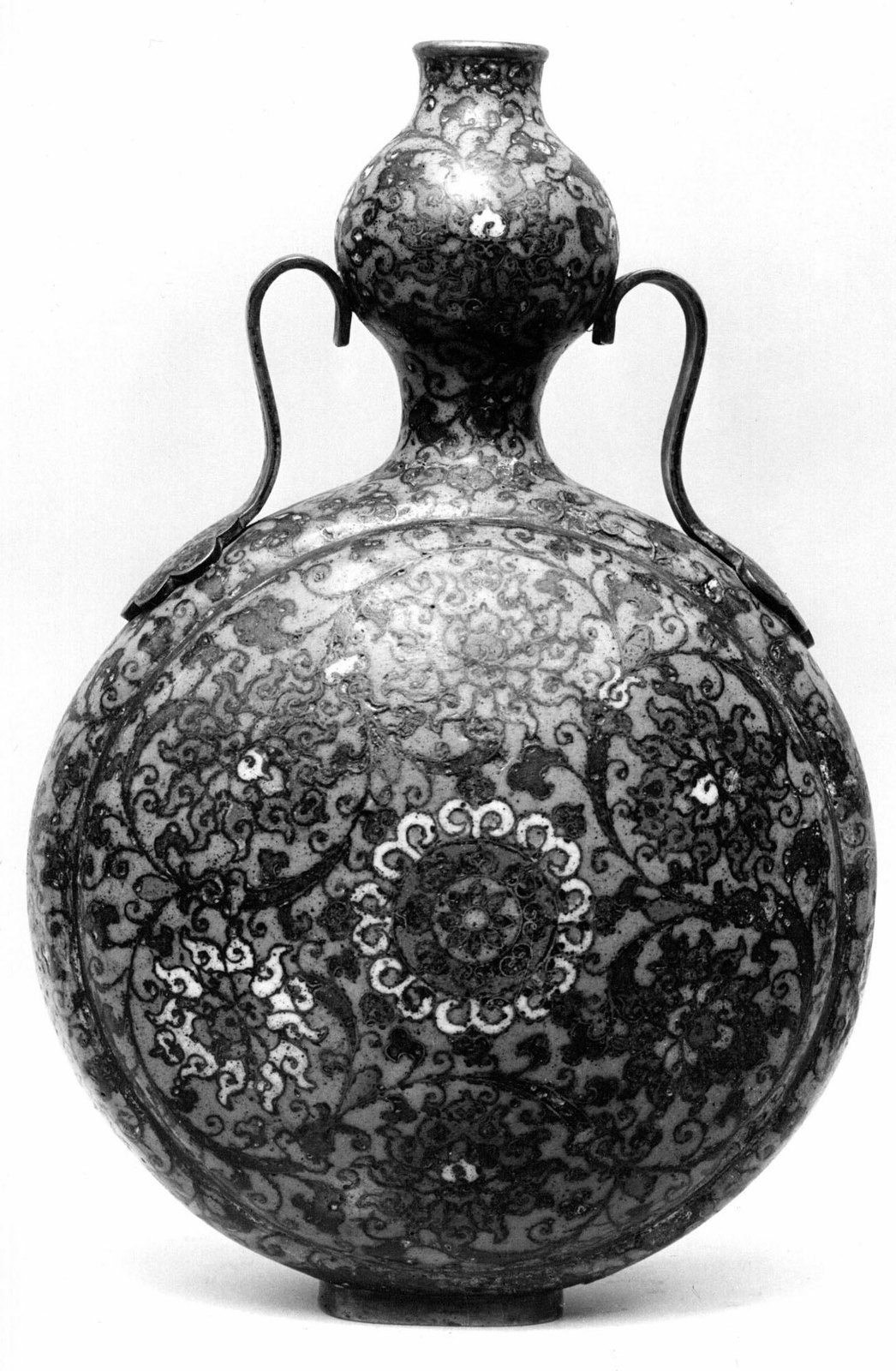 Monochrome photograph of a cloisonné pilgrim bottle with two curved handles