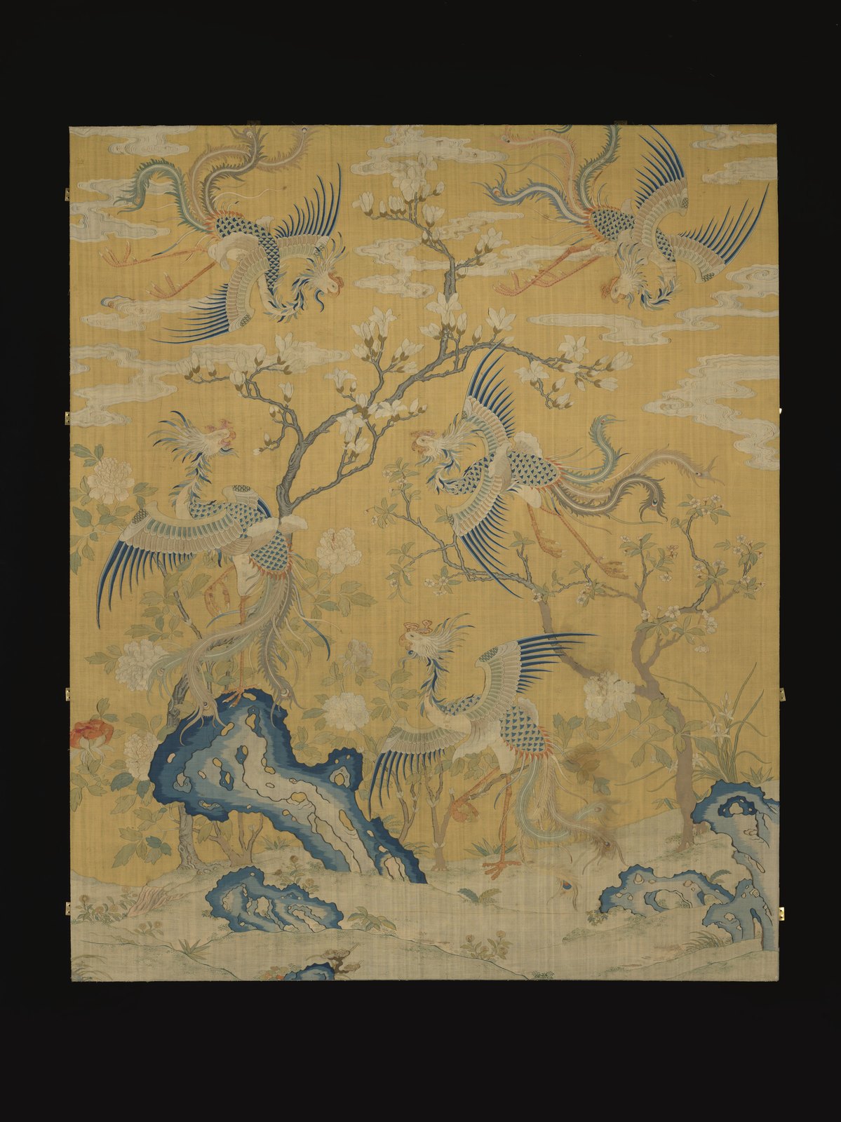 Eighteenth-century yellow kesi panel with five long-tailed fenghuang birds among flowers, rocks and clouds