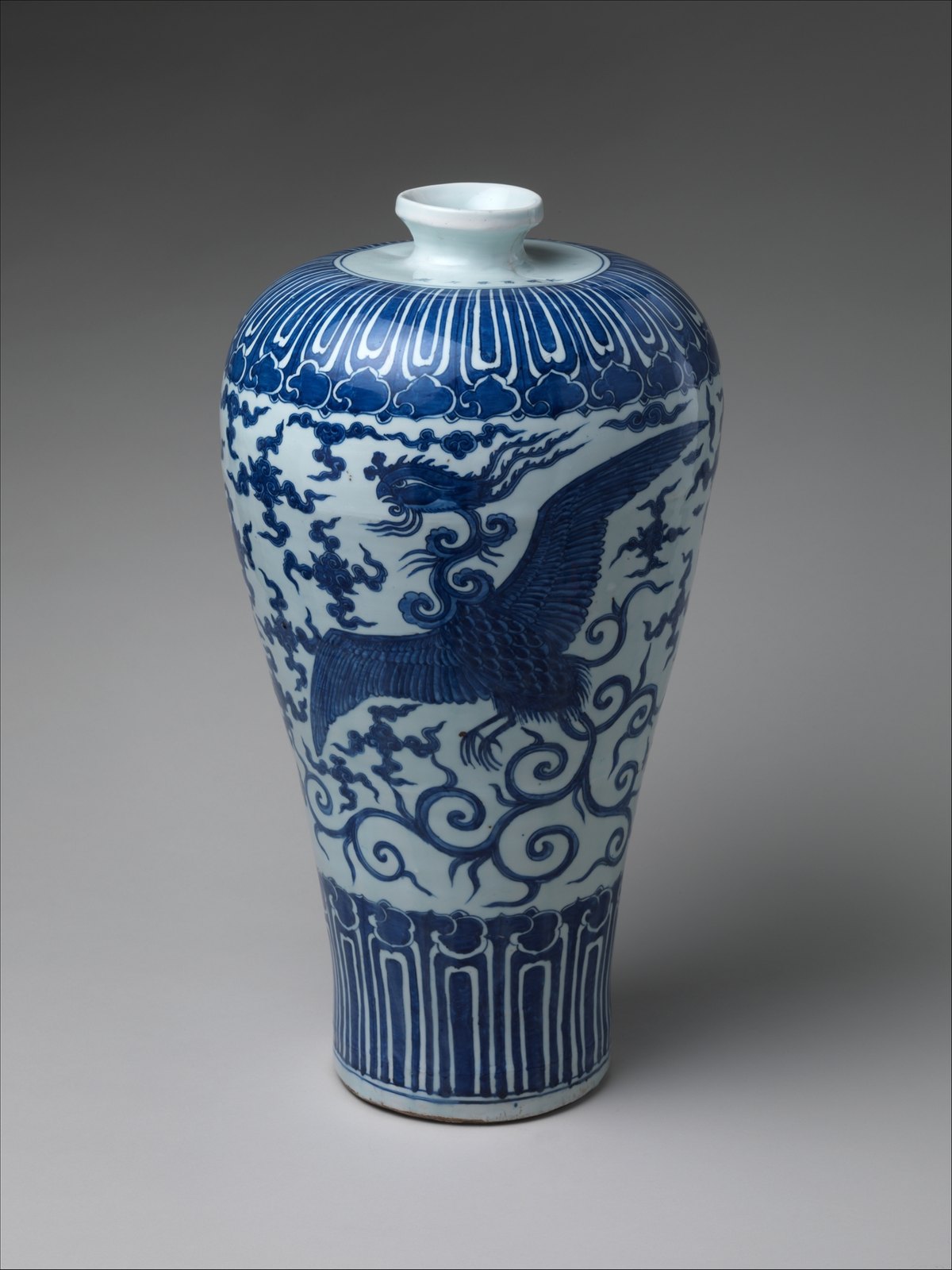 Tall blue-and-white meiping vase painted with a large fenghuang flying among cloud scrolls