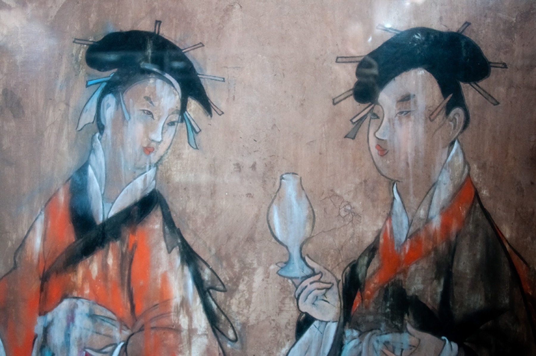 Detail of a late Eastern Han tomb mural showing two women in layered robes