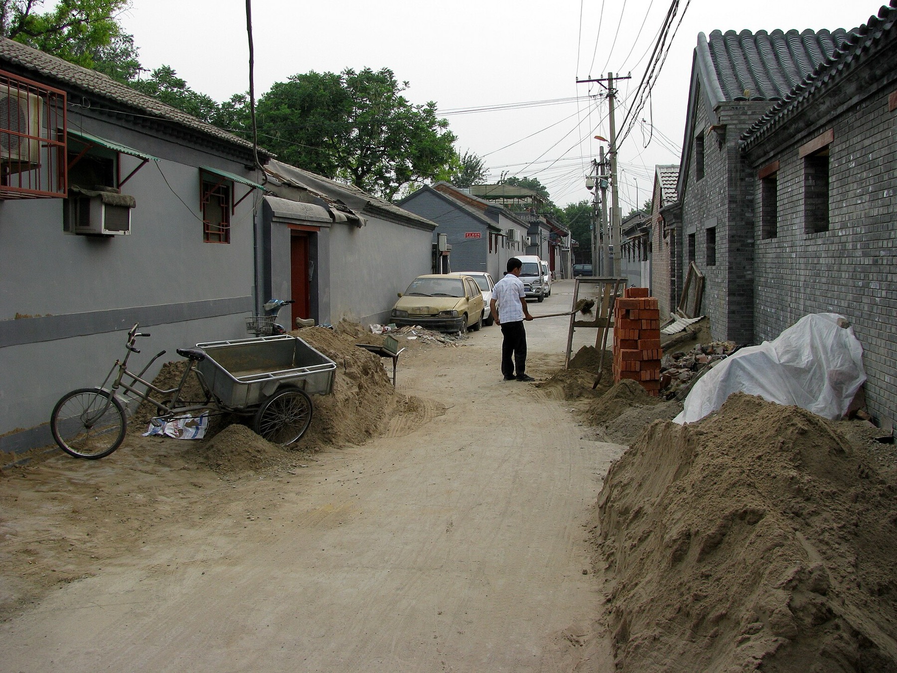 A view along Beixin Hutong shows the intimate width of a residential lane.