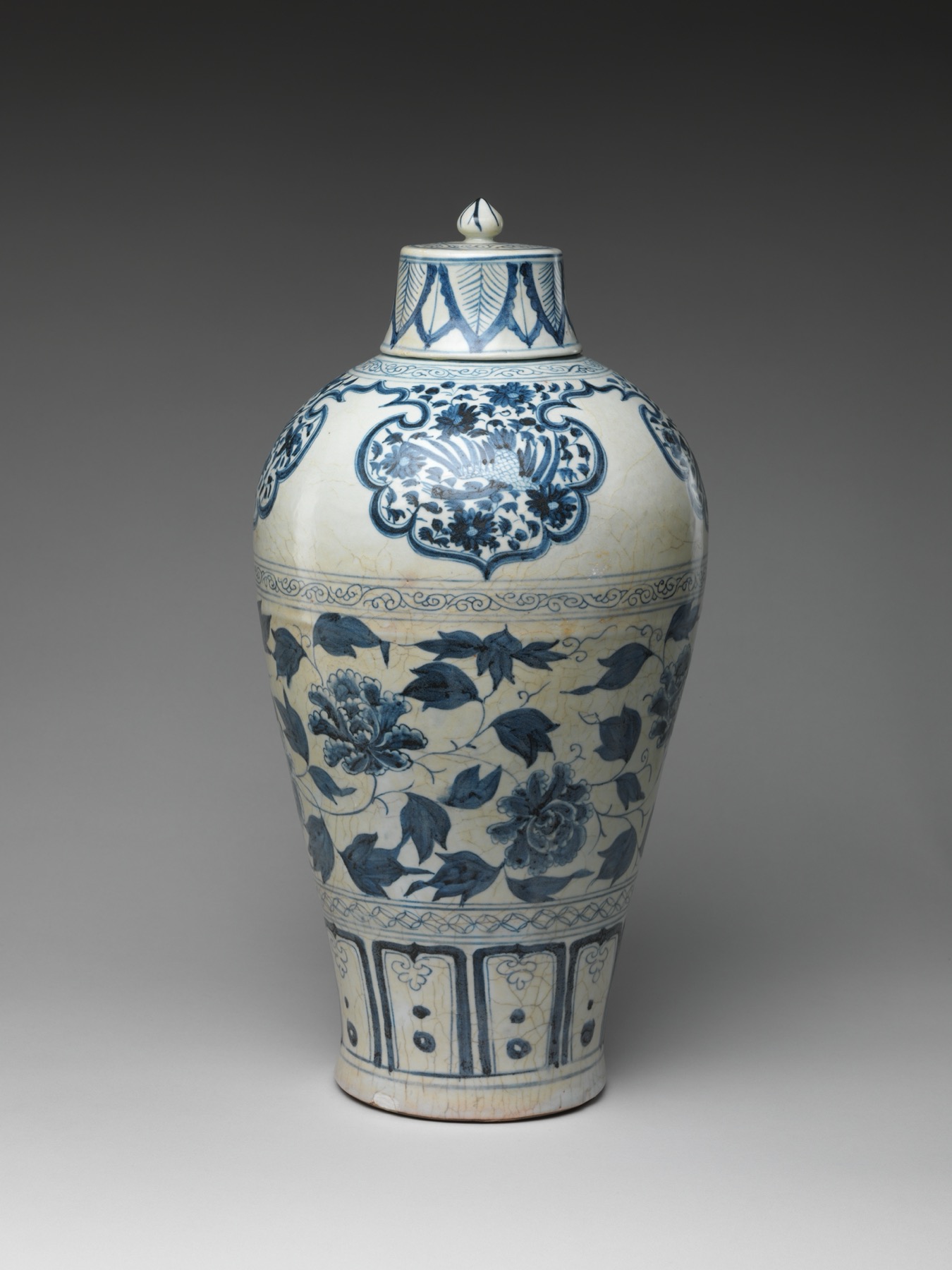 Blue-and-white porcelain bottle with cobalt peonies made near Jingdezhen.
