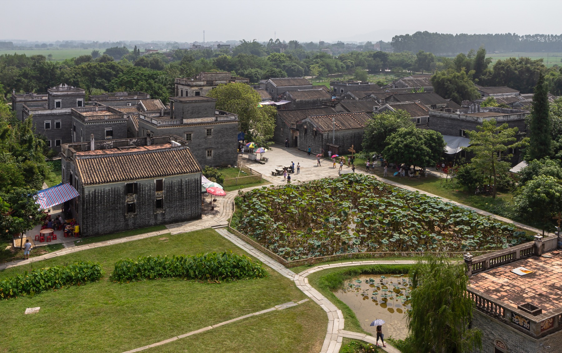Zili Village reveals the towers as part of an agricultural landscape.