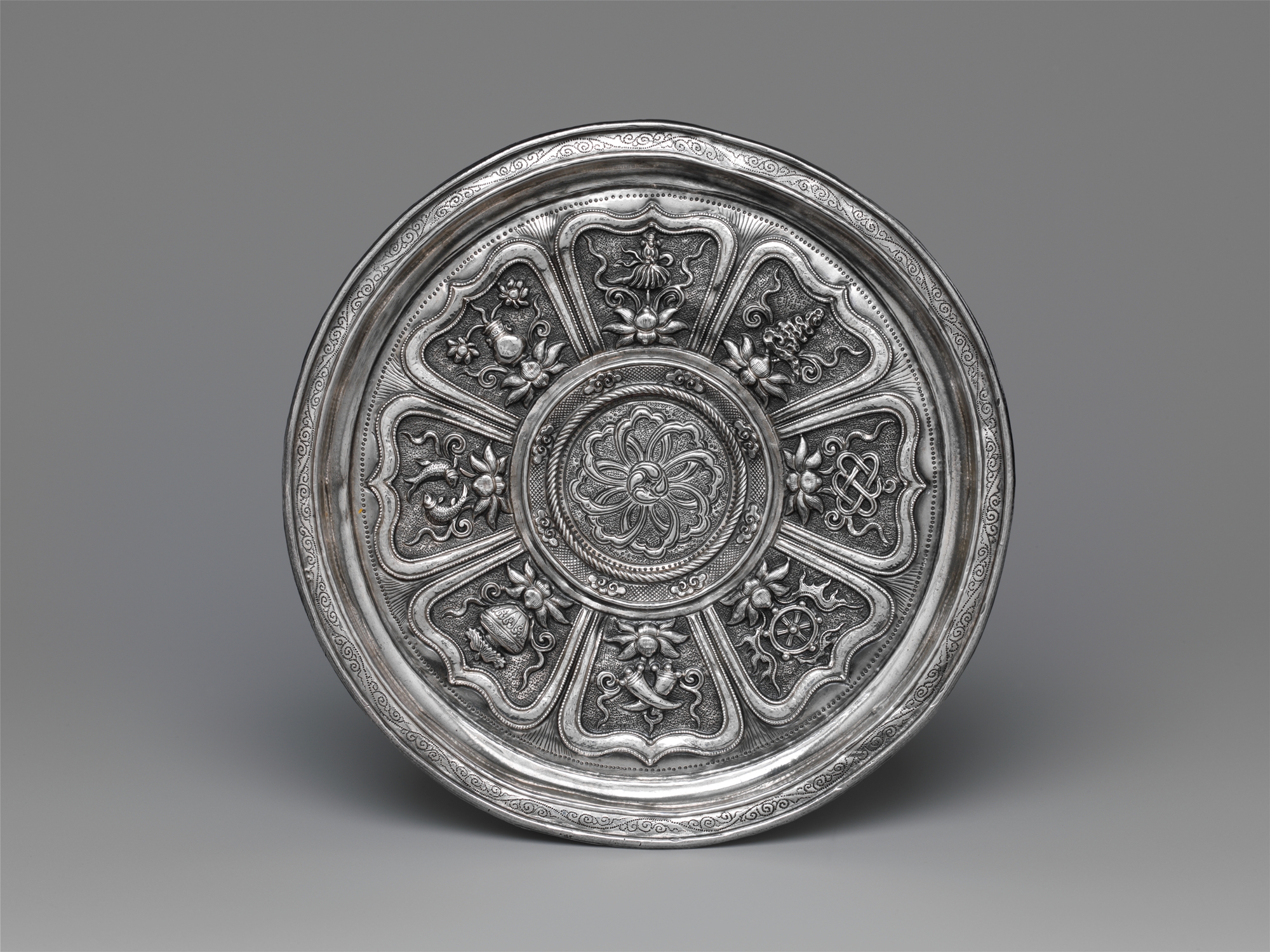 Yuan silver cup stand decorated with the Eight Buddhist Treasures.