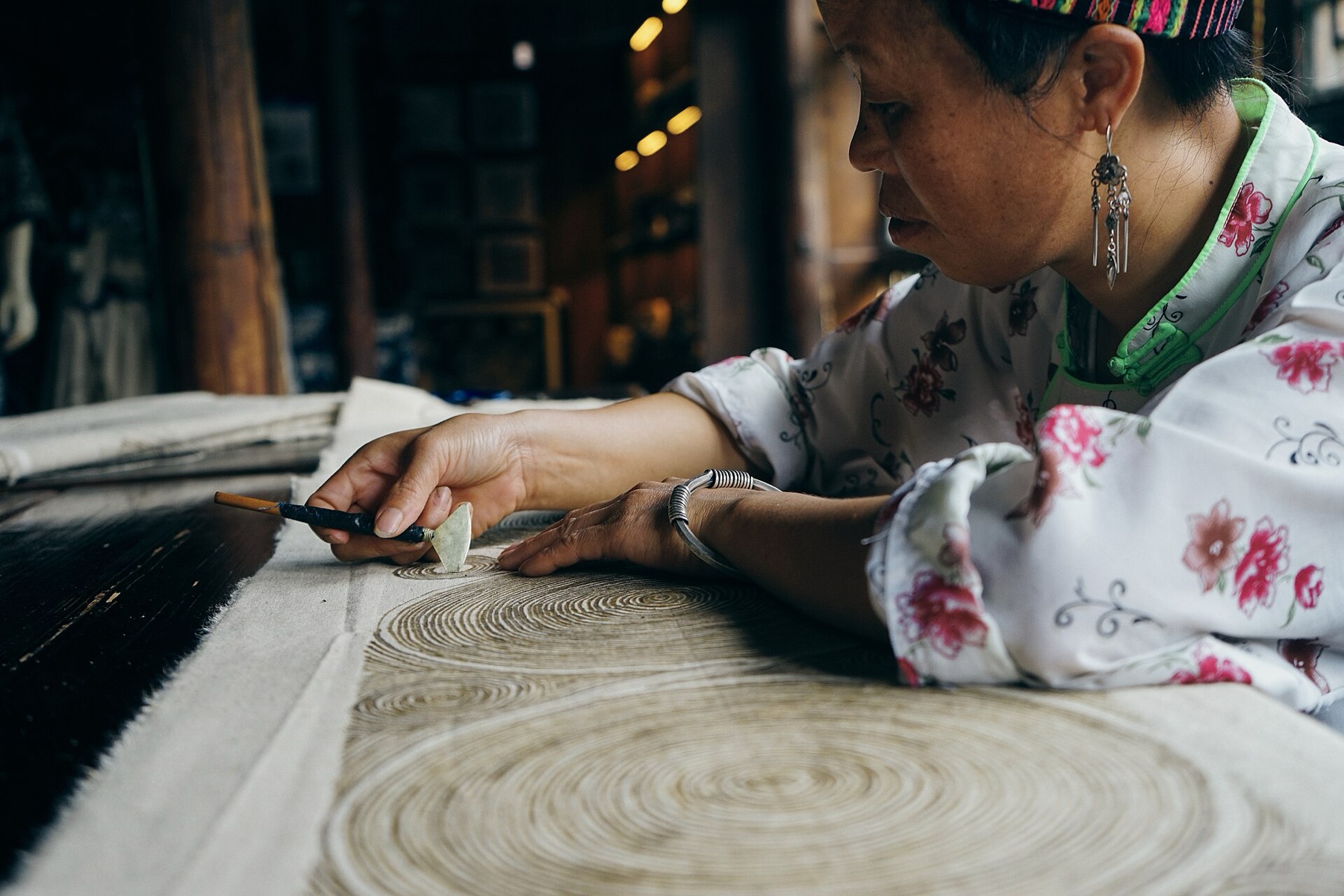 Indigo-resist batik displays a Miao textile tradition documented in Guizhou.