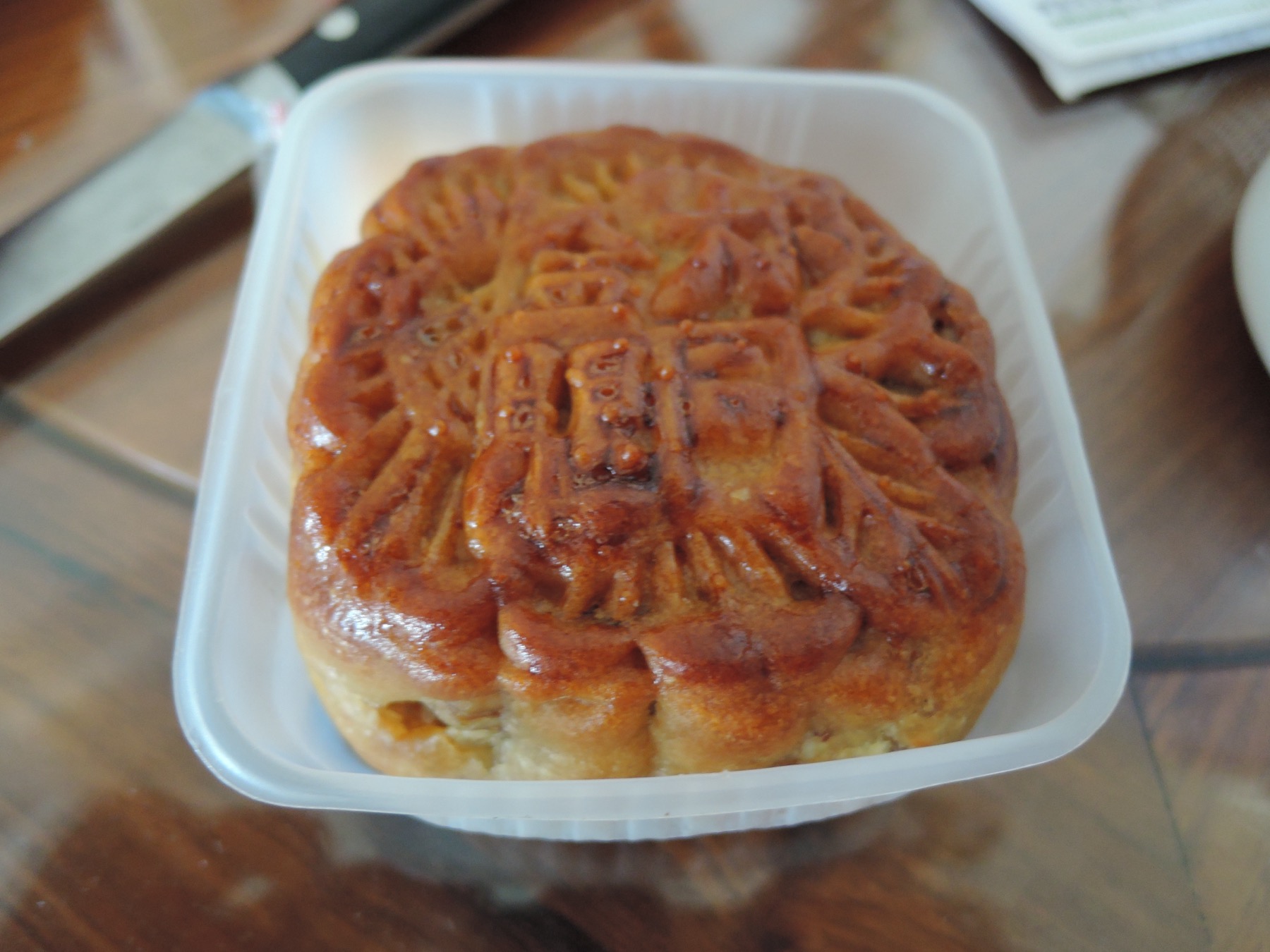 A mooncake connects the celebration’s lunar imagery with food designed to be shared.