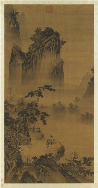 Small figures stand on a terrace below steep mountains in a vertical ink landscape.