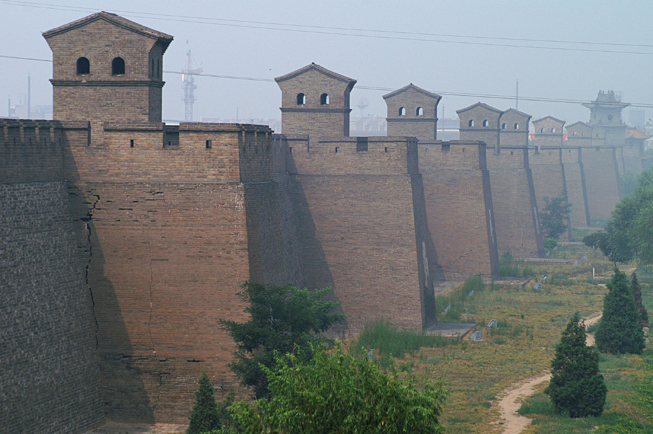 A historic gate connects defensive architecture with the streets inside Pingyao.
