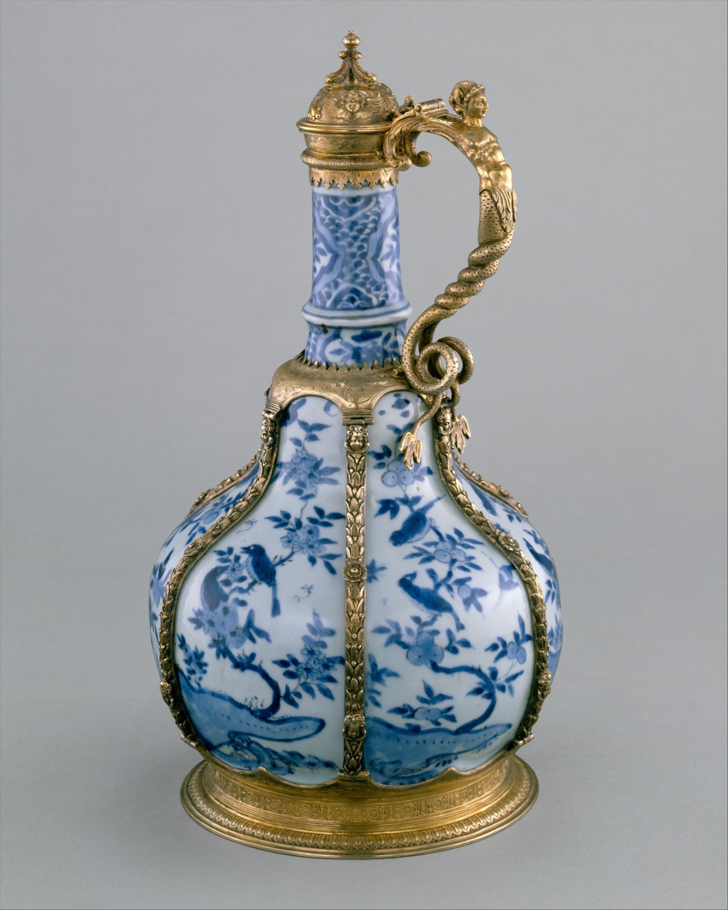 Chinese blue-and-white porcelain fitted with British metal mounts embodies the object’s early global circulation.