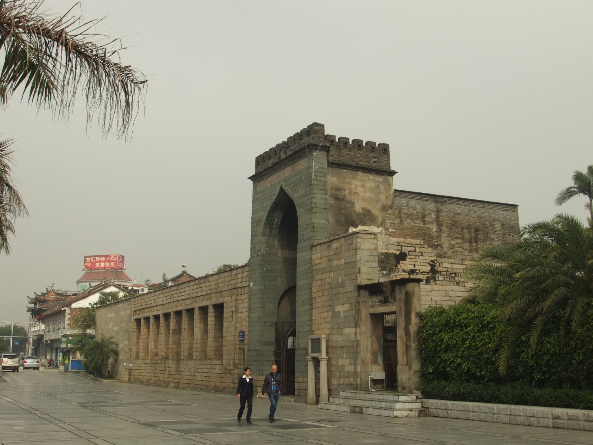 The pointed stone entrance of Qingjing Mosque faces a Quanzhou street.