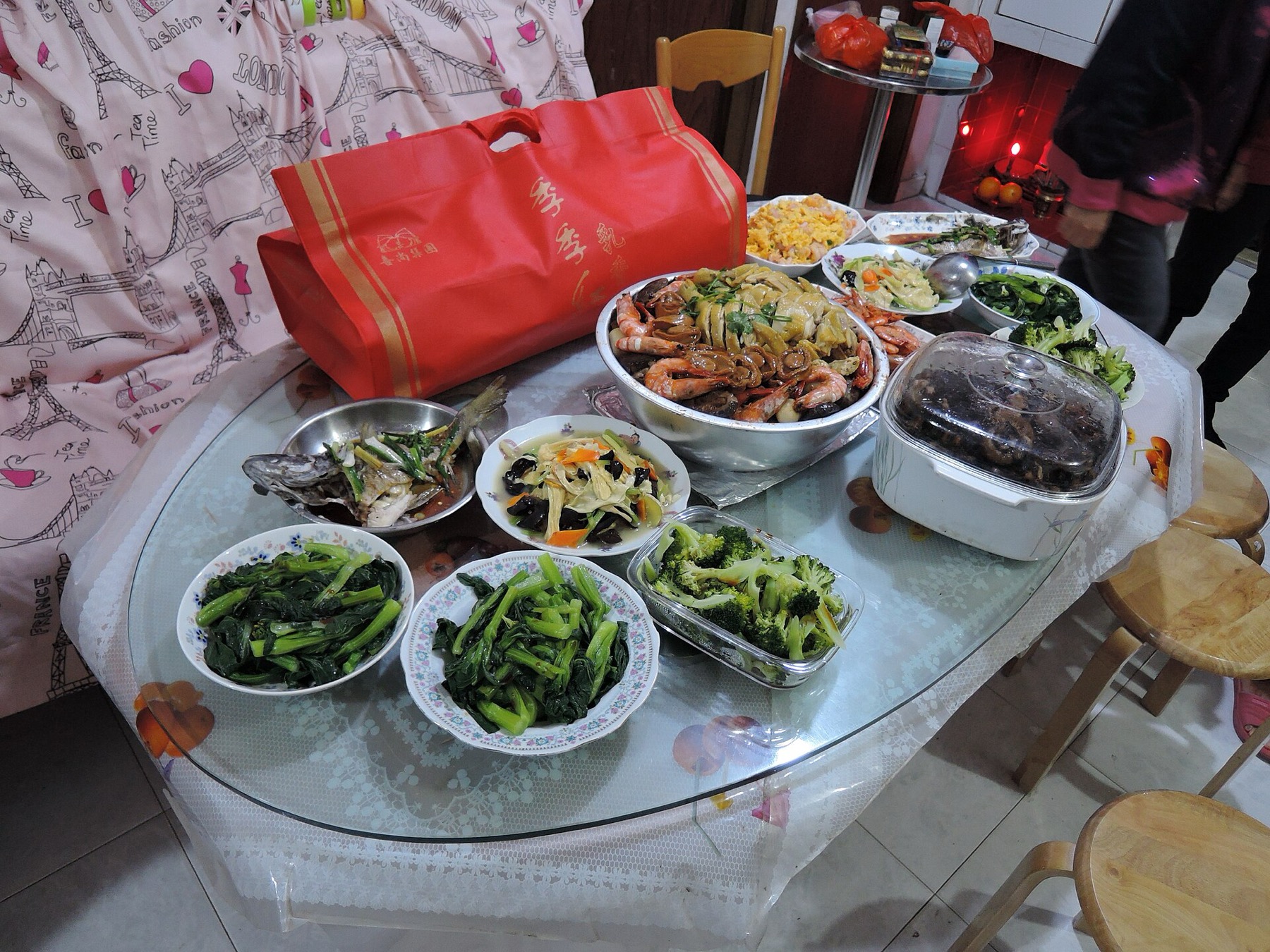 A family shares dinner at home in Yuen Long, Hong Kong.