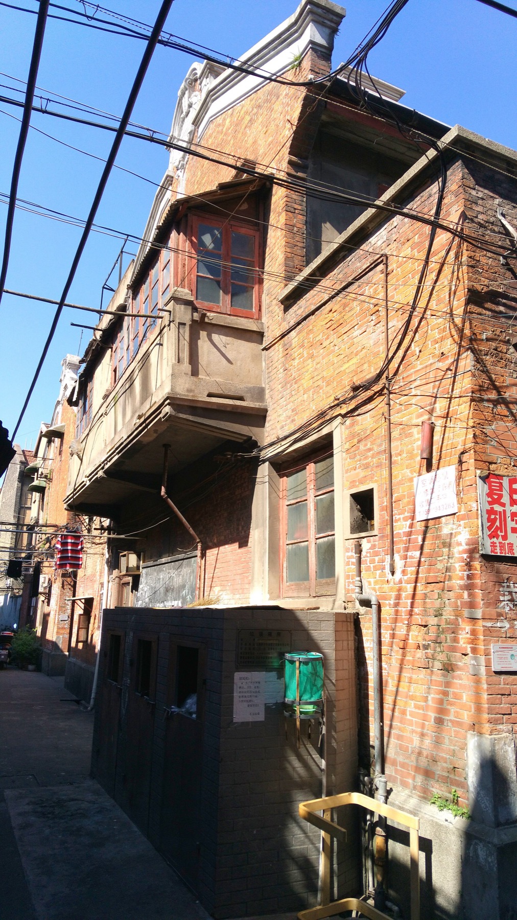 The attic and upper stories of Qingfu Li reveal the vertical density of lilong housing.