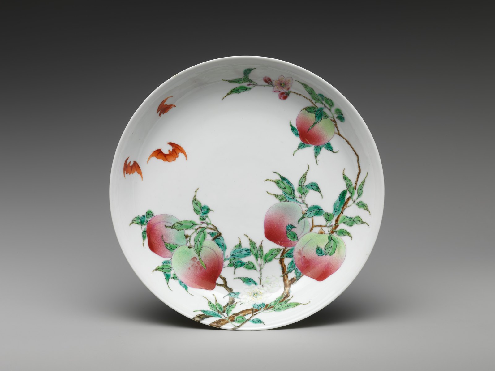 White porcelain dish painted with peaches, branches and bats